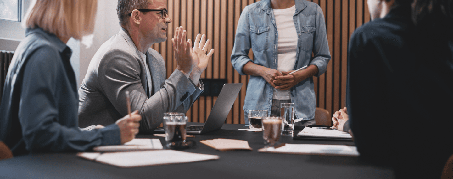 peope around a table talking